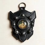 OROCUFF Mountain Cross leather shield luggage tag front view with complete attachment ring